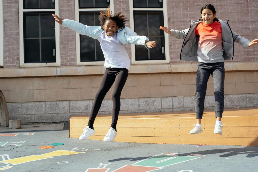 kids jumping on school playground